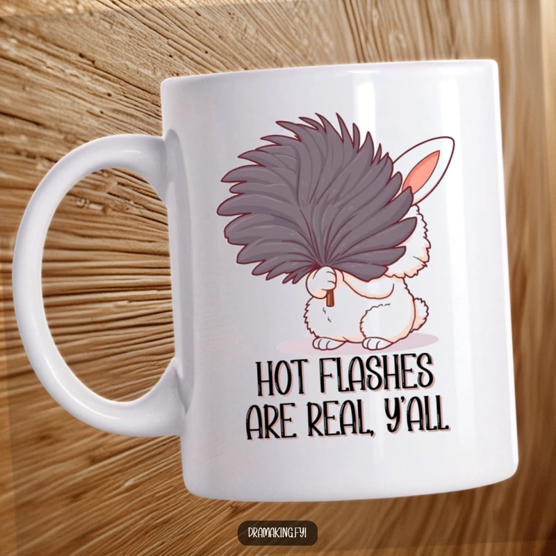 Funny mug featuring a fluffy bunny dramatically fanning itself with a large feather, looking hot and bothered but fabulous.