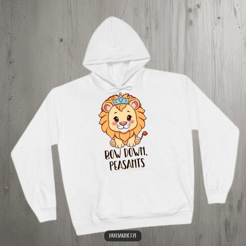 Funny lion cub wearing a sparkling crown, depicted on a cozy hoodie, radiating pride and humor for a gift.