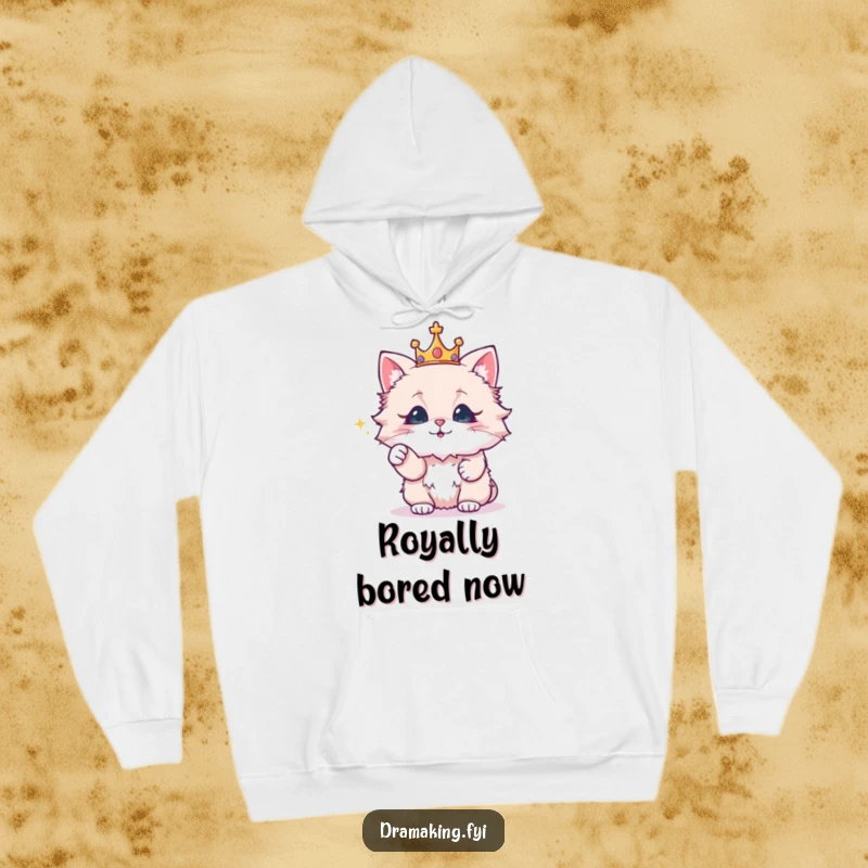 Funny hoodie with a fluffy cat wearing a crown, dramatically pointing at a sparkling object, for cozy, regal wear.