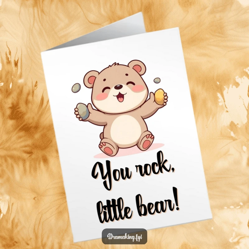 Funny Free Printable Congratulations Card depicting a cheerful bear cub character enthusiastically juggling three shiny pebbles.