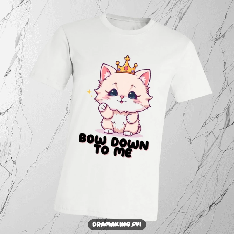 Funny t-shirt with a fluffy cat wearing a crown, dramatically pointing at a sparkling object, for a regal feline fan.